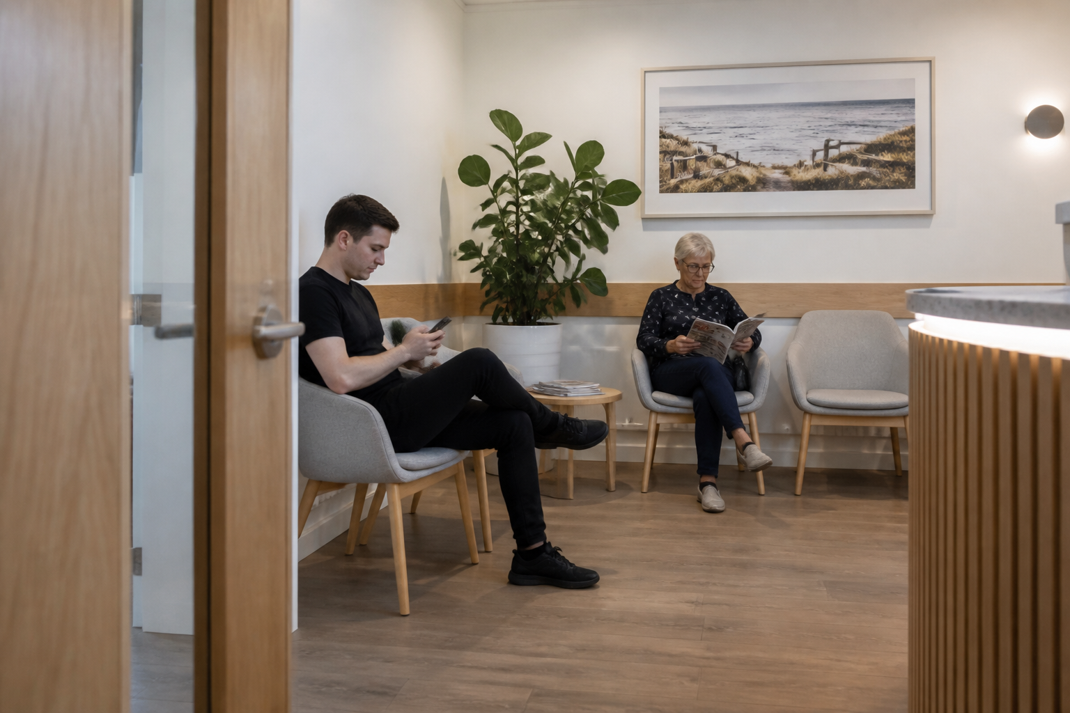 Two people reading in a waiting room